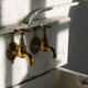 Detailed photograph of the taps in Charles Rennie Mackintosh building's loggia